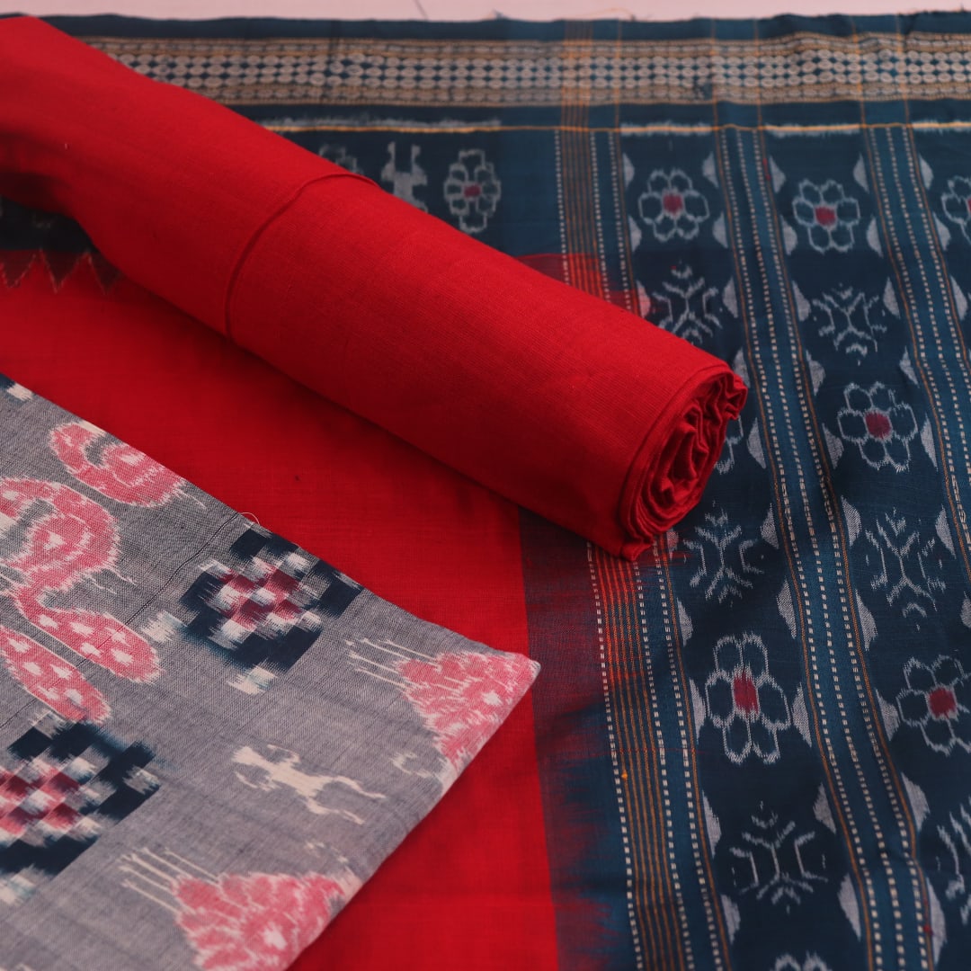 Detail of grey Sambalpuri Cotton dress material blouse piece with red motifs.