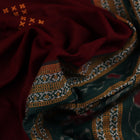Full view of a maroon and green cotton Bomkai saree with a butta pattern.