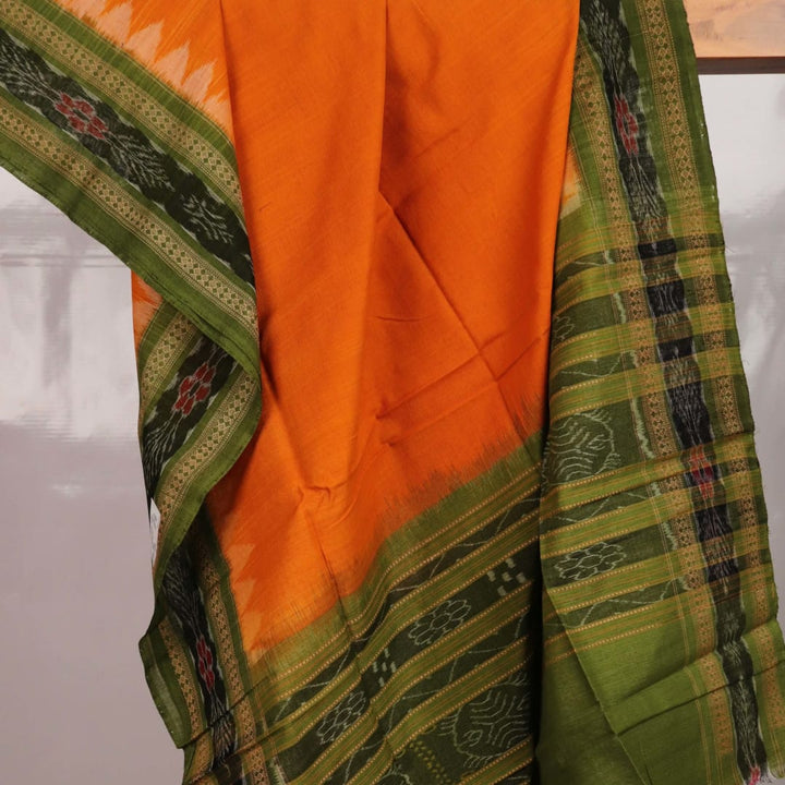 Yellow and green cotton Sambalpuri dupatta with plain body and patterned border, styled for draping