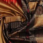 Close-up view of the vibrant and intricate silk fabric texture of a multicolored Bomkai silk saree with a black butta pattern.
