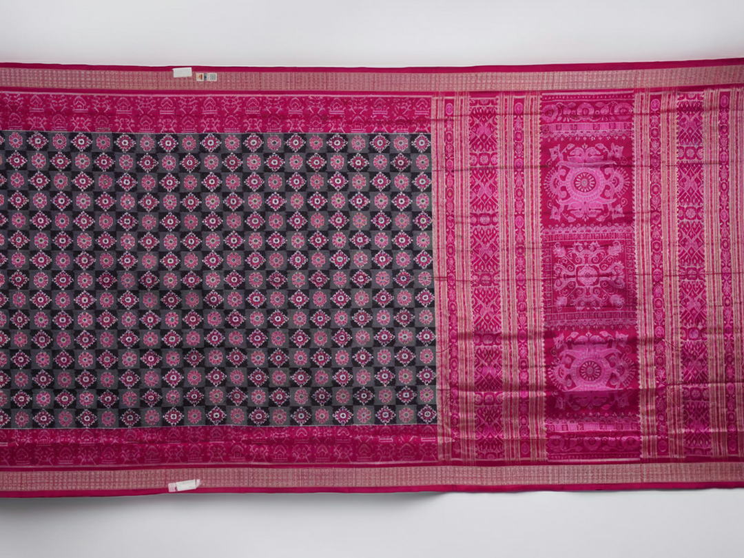Detail of the luxurious silk texture and exquisite handloom weave of the Multi-color Pink Sambalpuri Saree.