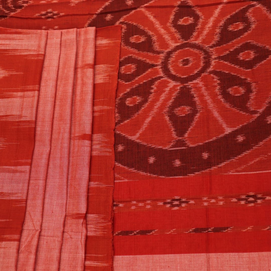 Styling view of a plain multi-color & rust Sambalpuri cotton saree.