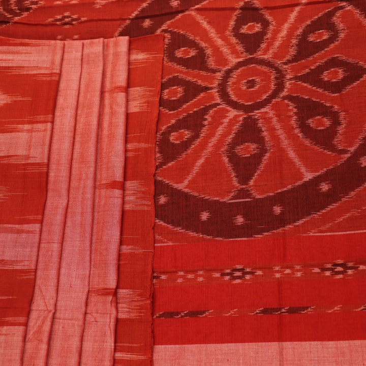 Styling view of a plain multi-color & rust Sambalpuri cotton saree.