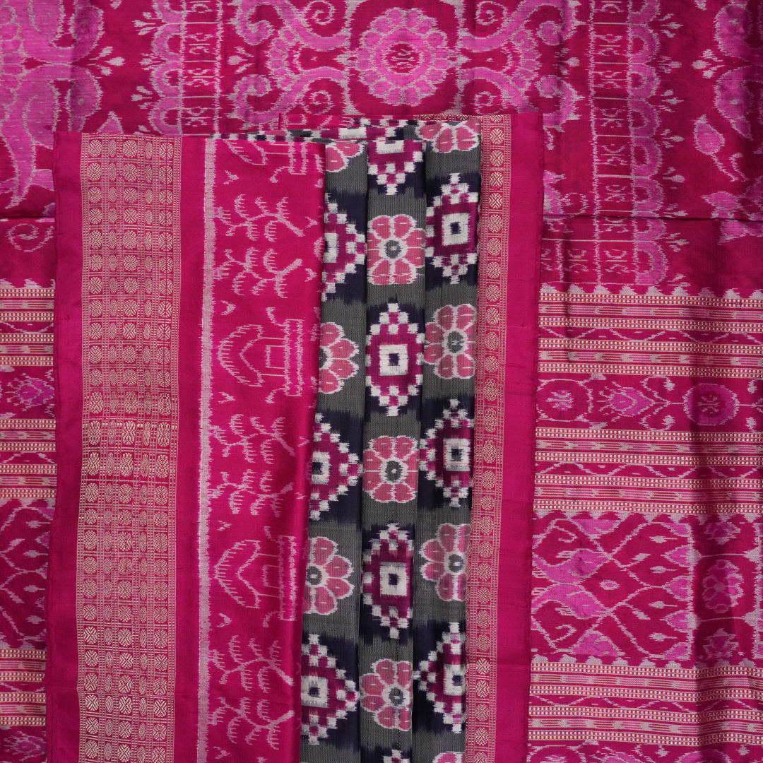Detail of the luxurious silk texture and exquisite handloom weave of the Multi-color Pink Sambalpuri Saree.
