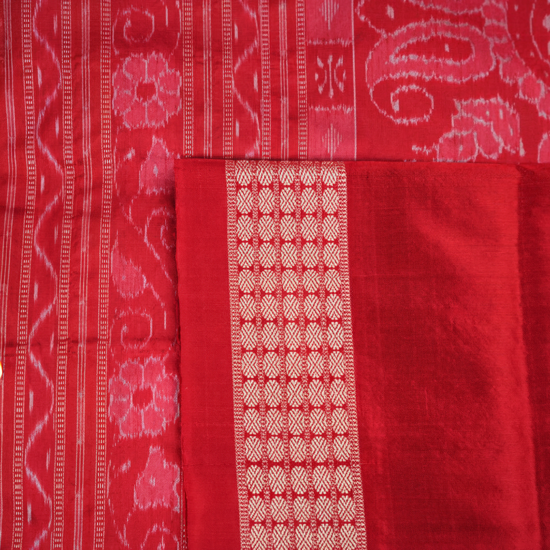 Close-up showing the rich, smooth texture of the green Sambalpuri Silk Saree's weave, highlighting its quality.