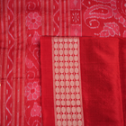 Close-up showing the rich, smooth texture of the green Sambalpuri Silk Saree's weave, highlighting its quality.