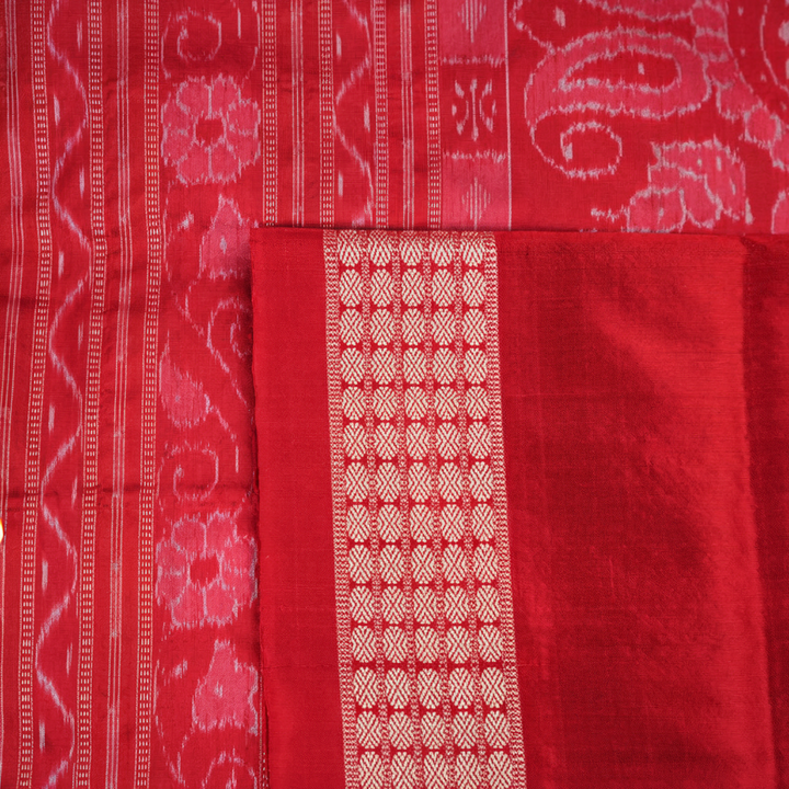 Close-up showing the rich, smooth texture of the green Sambalpuri Silk Saree's weave, highlighting its quality.