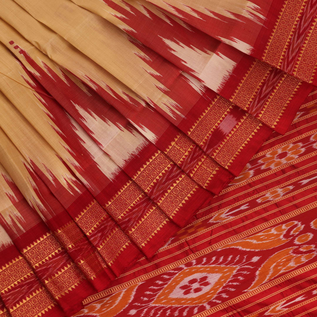 Saree styling: Cream Khandua silk saree with maroon butta pattern draped elegantly.