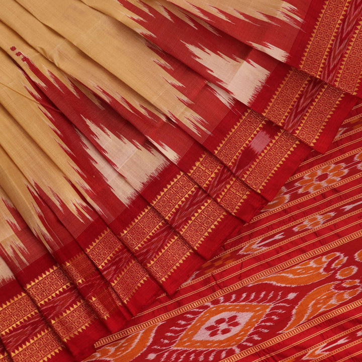 Saree styling: Cream Khandua silk saree with maroon butta pattern draped elegantly.