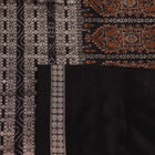 Close-up of magenta and black Bomkai silk saree texture, showing butta pattern weave.