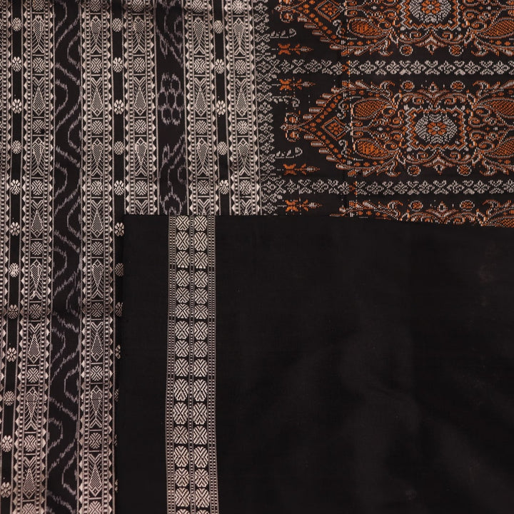 Close-up of magenta and black Bomkai silk saree texture, showing butta pattern weave.