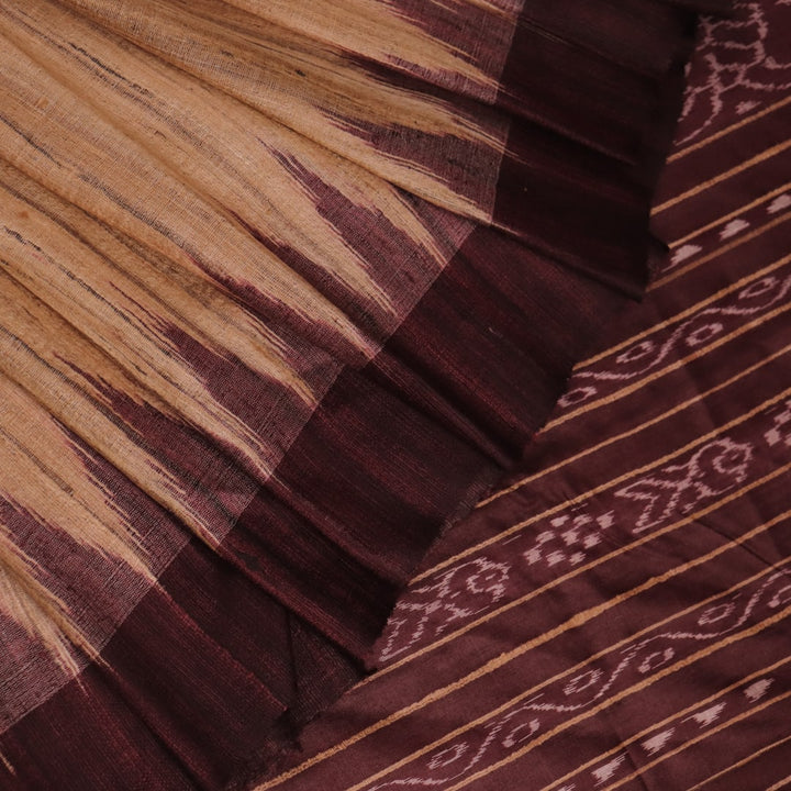 Close-up view of the textured Tussar Silk fabric of a Cream and Maroon Plain Tussar Saree