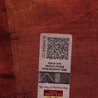 Close-up showing the textured weave of a yellow and brown printed Tussar silk saree.