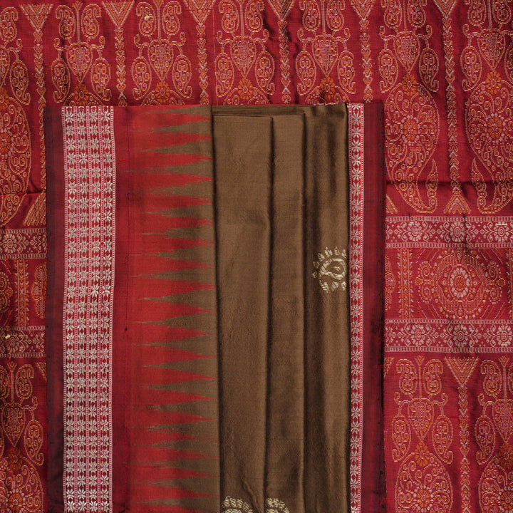 Close-up of Bomkai Silk Saree fabric, highlighting its luxurious brown silk texture and intricate weave.