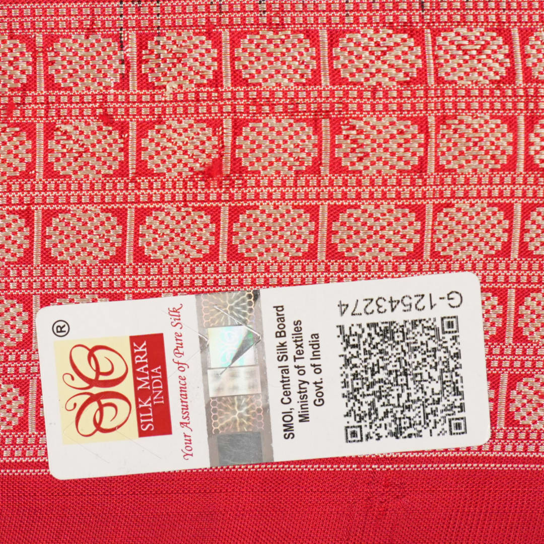 Close-up of the rich, smooth texture of the black Sambalpuri silk saree fabric.