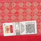 Close-up of the rich, smooth texture of the black Sambalpuri silk saree fabric.