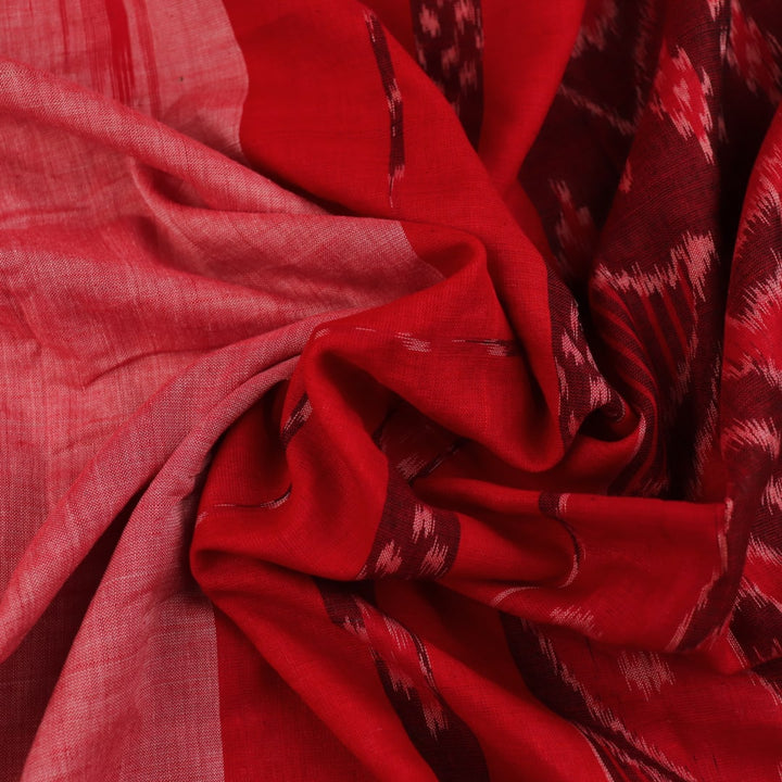 Pink and red Sambalpuri cotton saree draped; showcases overall look and styling with motifs visible.