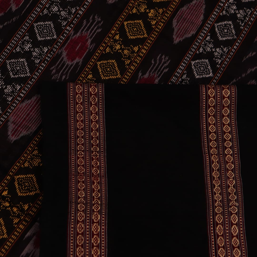 Full-length view of a pink Bomkai cotton saree featuring black butta patterns.