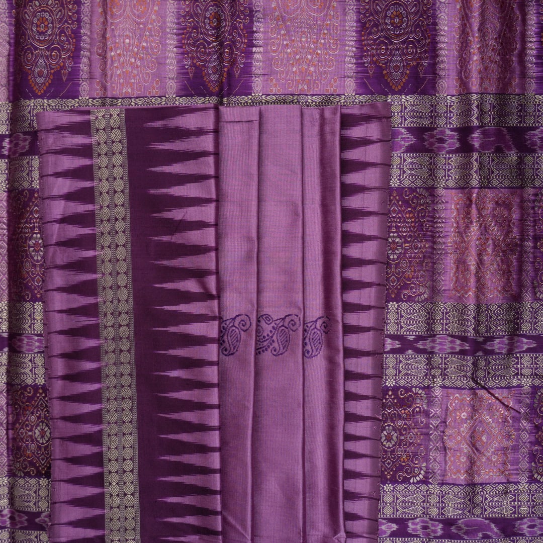 Close-up of purple Bomkai Silk Saree fabric, revealing its luxurious silk texture and exquisite handloom weave.