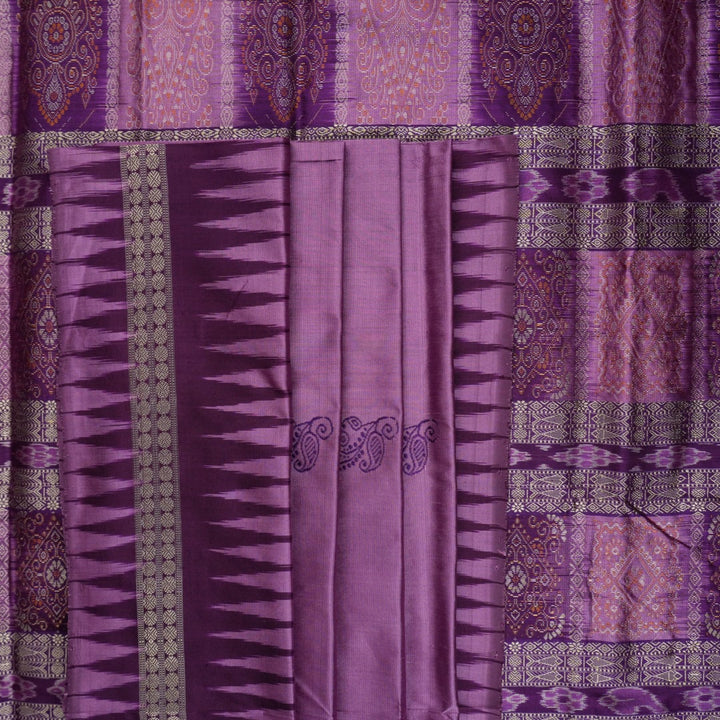 Close-up of purple Bomkai Silk Saree fabric, revealing its luxurious silk texture and exquisite handloom weave.