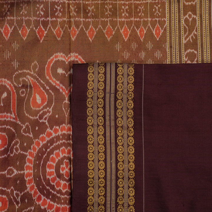 Close-up of Sambalpuri silk fabric texture, highlighting the fine weave in pink and maroon with delicate tissue motifs.