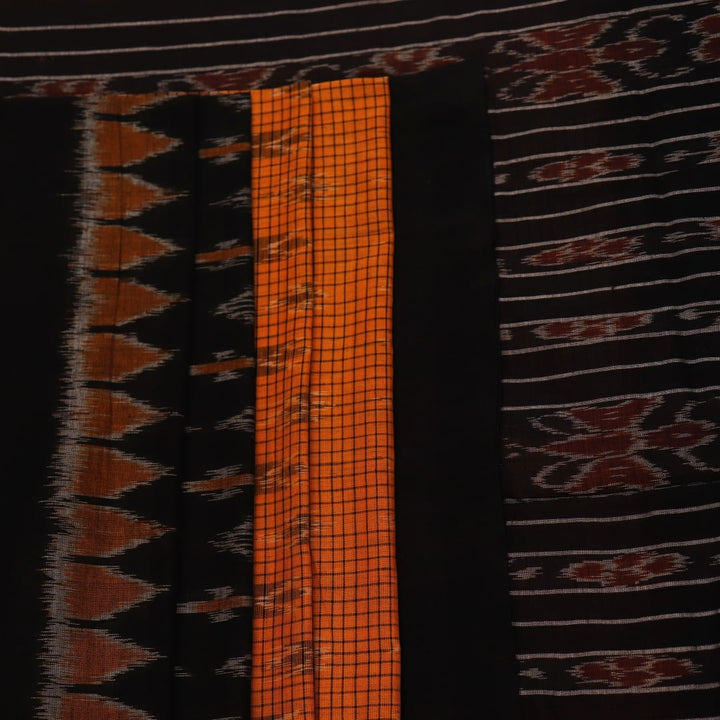 Woman draped in a yellow and black Sambalpuri cotton saree, showcasing the stylish drape and motif pattern.