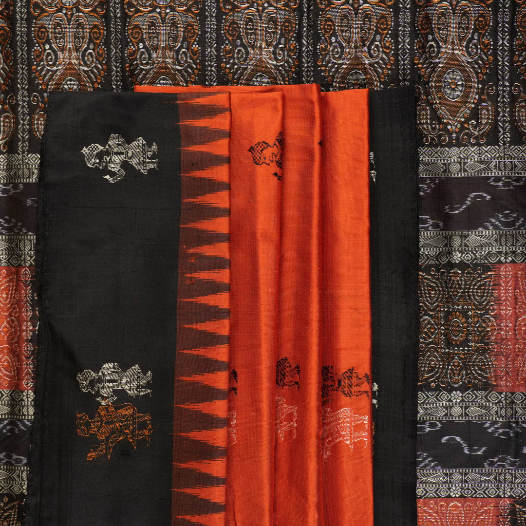 Ultra close-up of Bomkai Silk Saree fabric, revealing intricate handloom texture and butta weave details.