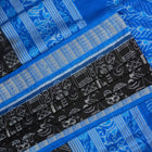Close-up of Sambalpuri Silk saree fabric, revealing its rich texture and intricate black and blue weave.