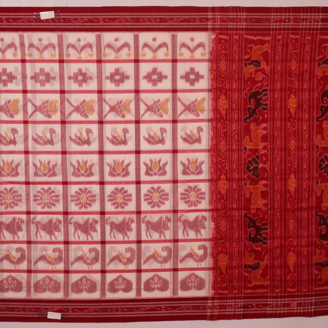 Full view of a white and red Sambalpuri cotton saree with traditional motifs.