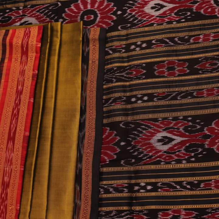 Green and black Khandua silk saree draped; showcasing its butta pattern and elegant fall.