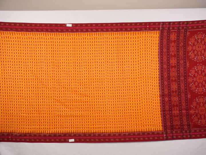 Full styling view of a model draped in a yellow and maroon Sambalpuri cotton saree with motifs.