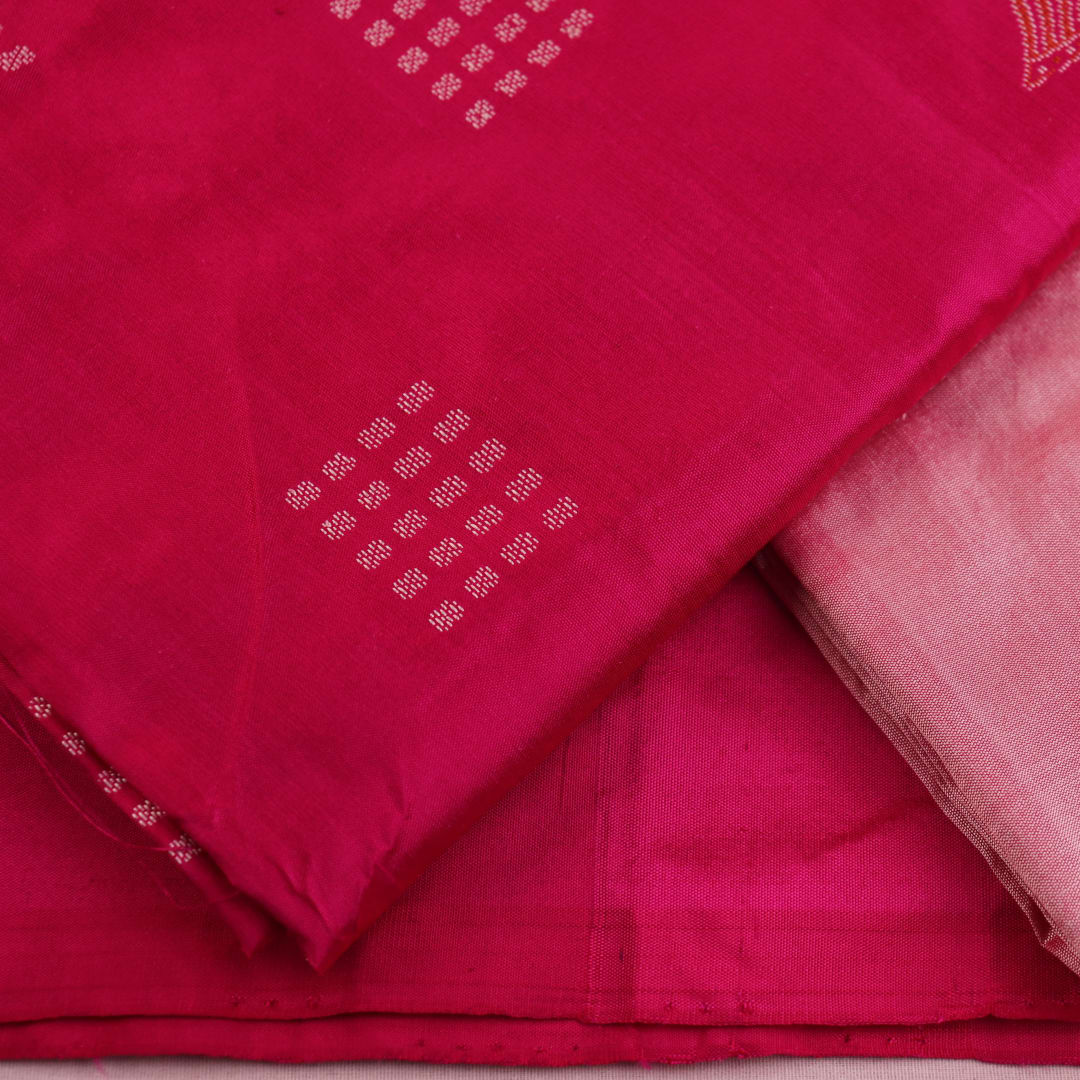 Close-up of Pink and Peach Bomkai Silk Dress Material's Butta pattern blouse piece.