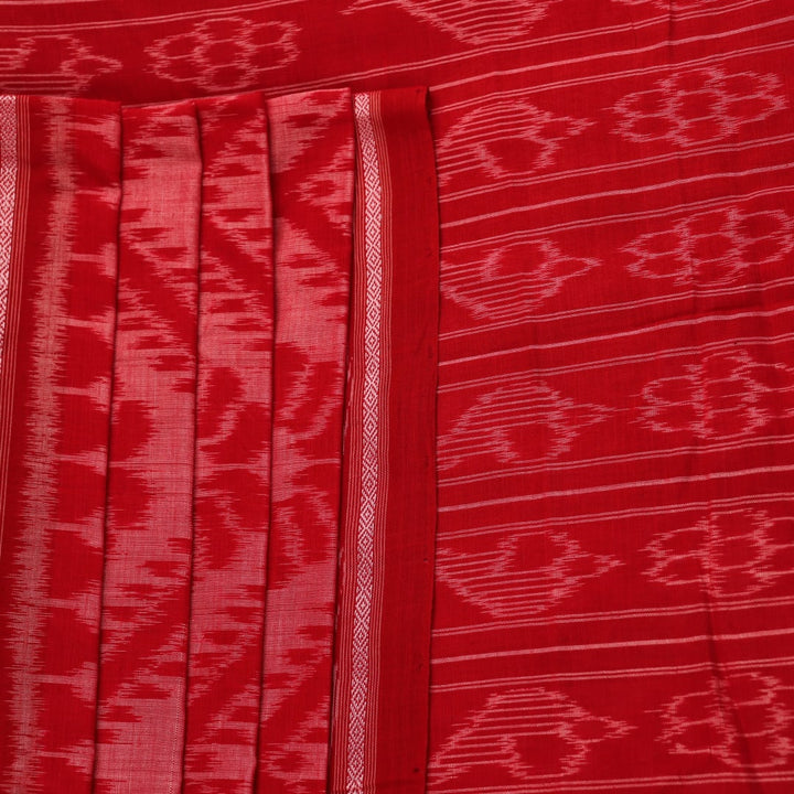 Red and green cotton Sambalpuri saree with traditional motifs draped on a model