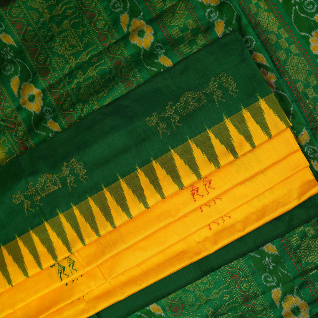 Extreme close-up of yellow Bomkai Silk Saree fabric, revealing the rich silk texture and weave.