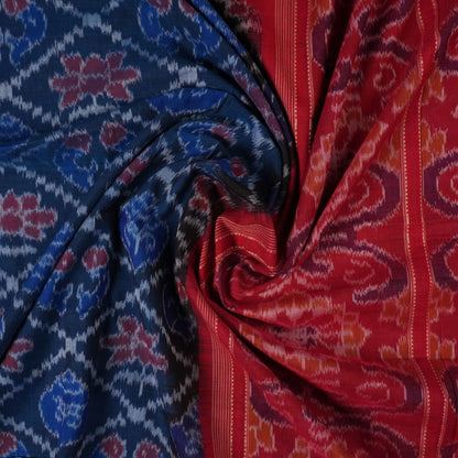 Full flat lay view of a blue and red Sambalpuri cotton saree showcasing the entire body and pallu design.