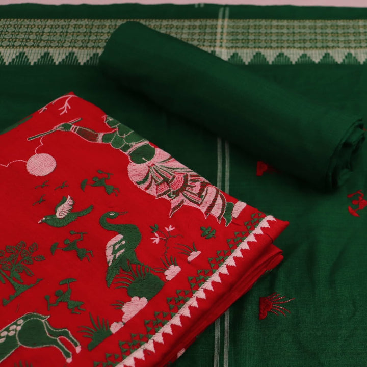 Red and green cotton Sambalpuri dress material with a doll pattern on the body of the fabric.