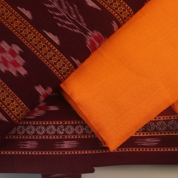 Close-up of the maroon and yellow Sambalpuri cotton blouse piece with motifs for the dress material.