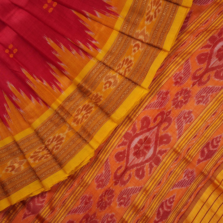 Model draped in a red and yellow Khandua silk saree with butta patterns for a traditional look.