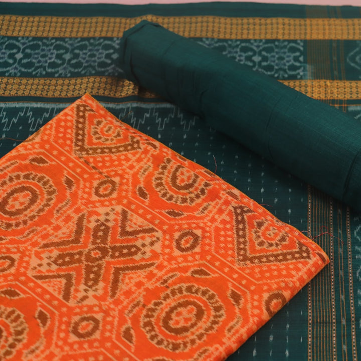 Blouse piece detail of an orange and green motif Sambalpuri cotton dress material.