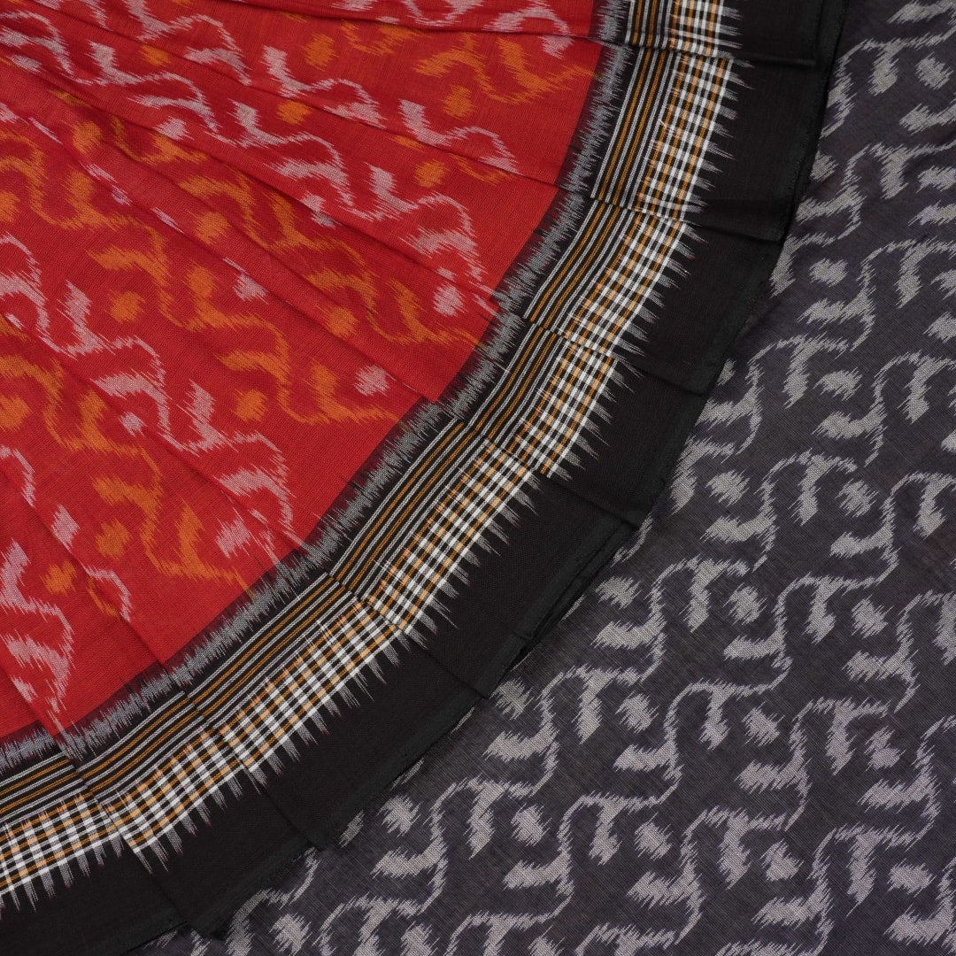 Model draped in a maroon and black Sambalpuri cotton saree showcasing elegant traditional handloom style