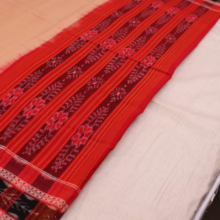 Cream-colored cotton Sambalpuri dupatta with red plain body and contrasting border, elegantly draped