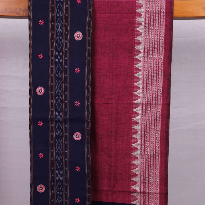 Close-up of blouse piece with blue and magenta motifs in Sambalpuri style