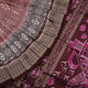 Close-up of the rich multi-color and maroon Sambalpuri silk fabric, highlighting its exquisite handloom weave texture.