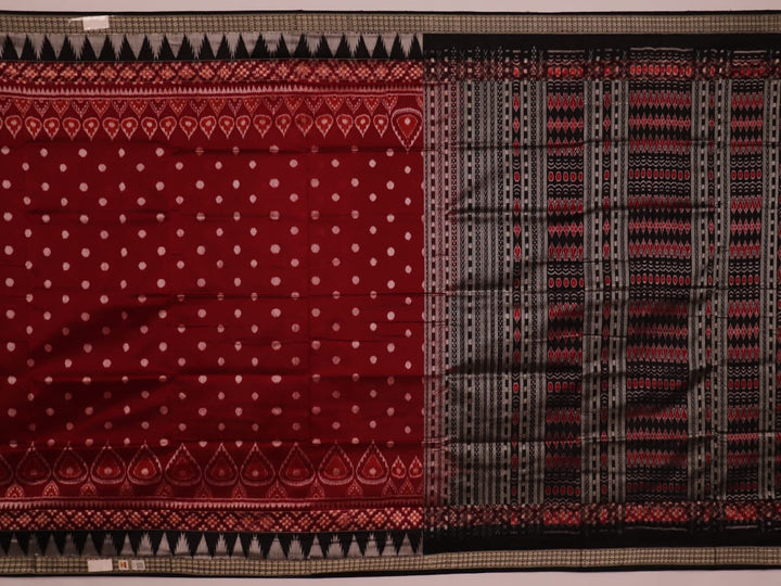 Close-up view of maroon and black silk Sambalpuri saree fabric showcasing intricate motifs