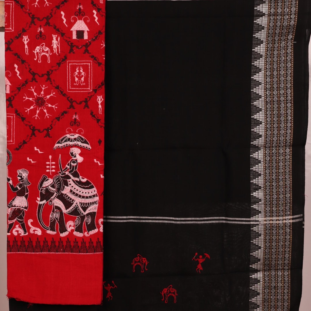 Close-up showcasing the intricate doll pattern on the cotton sambalpuri dress material in red and black.