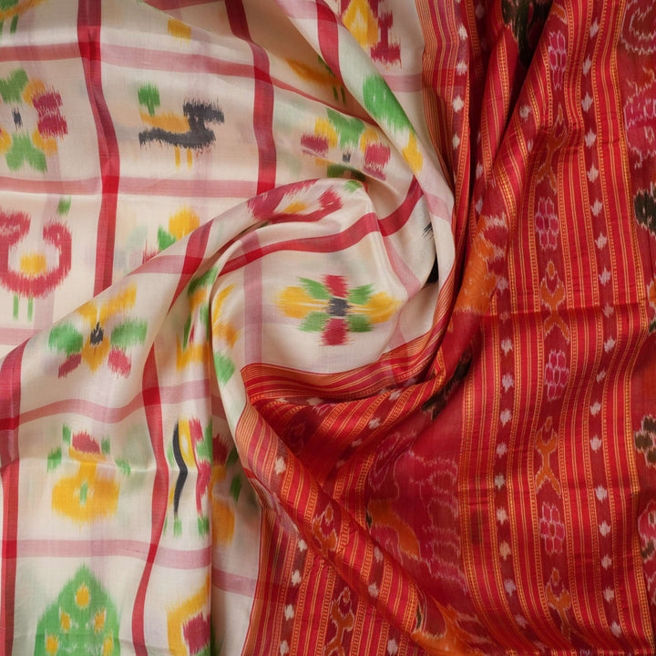 Model styled in a white and red Khandua silk saree showcasing its elegant fall and traditional Odia motifs.