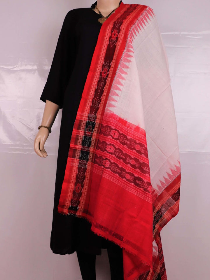 A woman wearing a white and red Sambalpuri cotton dupatta with a plain pattern, draped over her shoulder