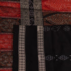 Detailed texture of handwoven Bomkai silk saree fabric in maroon and black with butta pattern.