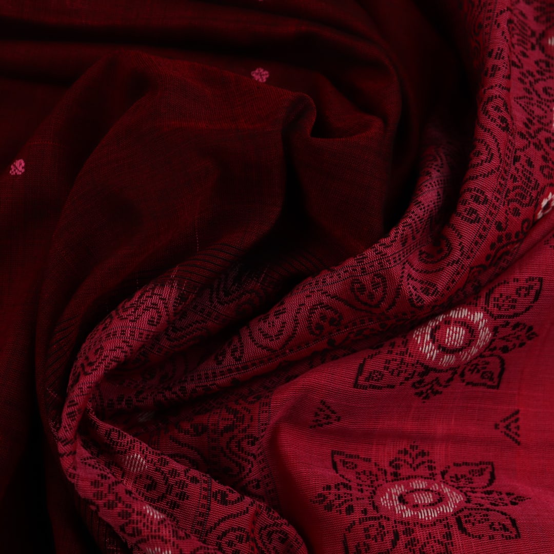 Full view of a maroon and pink cotton Bomkai saree featuring a butta pattern.