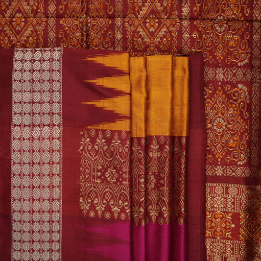 Ultra close-up of Bomkai silk saree fabric, revealing its luxurious texture and fine handloom weave.